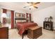 Comfortable bedroom with a ceiling fan, a fireplace, and natural light from the large window at 490 Dorsey Road Rd, Hampton, GA 30228