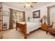 Cozy bedroom featuring a wood bed frame, natural light from the windows and carpeted floors at 490 Dorsey Road Rd, Hampton, GA 30228