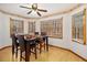 Cozy dining room featuring a ceiling fan and multiple windows offering natural light and scenic views at 490 Dorsey Road Rd, Hampton, GA 30228