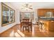 Bright dining room features wood floors, ceiling fan, and bay windows offering views of the surrounding landscape at 490 Dorsey Road Rd, Hampton, GA 30228