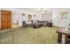 Cozy living room with a gray sofa, ceiling fan, and large window, perfect for relaxing or entertaining at 490 Dorsey Road Rd, Hampton, GA 30228