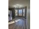 Dining area with bay window and wood-look floors at 10411 Ivygate Ter, Jonesboro, GA 30238