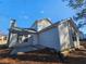 Rear view of house showing patio and gray siding at 10411 Ivygate Ter, Jonesboro, GA 30238