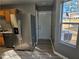 Kitchen with stainless steel refrigerator and exterior door access at 10411 Ivygate Ter, Jonesboro, GA 30238