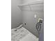 Laundry room with gray walls, wire shelving and vinyl flooring at 10411 Ivygate Ter, Jonesboro, GA 30238