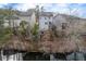 Aerial view of houses along a pond, showcasing their backyards and water views at 135 Cessna Dr, Canton, GA 30114