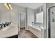 Elegant bathroom with double vanity, soaking tub, and shower at 135 Cessna Dr, Canton, GA 30114