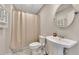 Basement bathroom with pedestal sink and shower at 135 Cessna Dr, Canton, GA 30114