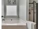 Bathroom with soaking tub and a walk-in shower at 135 Cessna Dr, Canton, GA 30114