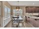 Kitchen dining area with table and chairs near windows at 135 Cessna Dr, Canton, GA 30114