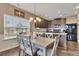 Bright dining area with table and chairs, adjacent to kitchen at 135 Cessna Dr, Canton, GA 30114