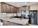 Modern kitchen with dark cabinets and granite countertops at 135 Cessna Dr, Canton, GA 30114