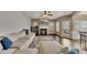 Large living area featuring sectional sofa, fireplace, and hardwood floors at 135 Cessna Dr, Canton, GA 30114
