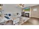 Living room with sectional sofa, fireplace, and hardwood floors at 135 Cessna Dr, Canton, GA 30114