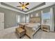 Main bedroom with carpeted floor, tray ceiling and en-suite bathroom at 135 Cessna Dr, Canton, GA 30114
