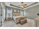 Large main bedroom with carpeted floor, tray ceiling and en-suite bathroom at 135 Cessna Dr, Canton, GA 30114