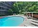 Refreshing outdoor pool area with comfortable seating, offering a relaxing and enjoyable experience for community members at 3060 Pharr Court N # 607, Atlanta, GA 30305