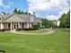 Community clubhouse with manicured lawn at 5590 Vickery Cir, Cumming, GA 30040