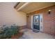 Brick entryway with a welcoming door and lighting at 5590 Vickery Cir, Cumming, GA 30040