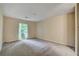 Well-lit bedroom with a view of the yard at 104 Woodhaven Way, Alpharetta, GA 30009