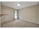 Neutral bedroom offers natural light from a window, gray carpet, and a closet for optimal storage at 104 Woodhaven Way, Alpharetta, GA 30009