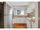 Functional kitchen with white cabinets, granite countertops, and modern appliances at 104 Woodhaven Way, Alpharetta, GA 30009