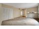 Open living room with neutral carpet and lots of space at 104 Woodhaven Way, Alpharetta, GA 30009