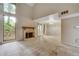 Spacious living room with a vaulted ceiling, stone fireplace, and lots of natural light at 104 Woodhaven Way, Alpharetta, GA 30009