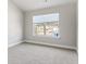 Well-lit bedroom with grey carpet and window blinds at 505 Paces Dr, Lithia Springs, GA 30122