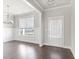 Bright dining room with hardwood floors, wainscoting, and a chandelier at 505 Paces Dr, Lithia Springs, GA 30122