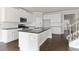 Modern kitchen with white cabinets, granite countertops, and stainless steel appliances at 505 Paces Dr, Lithia Springs, GA 30122