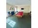 Living room features fireplace, pool table, and neutral colored walls at 6383 Phillips Ct, Lithonia, GA 30058