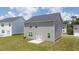 Two story home with gray siding and backyard at 175 Amberjack Trail, Covington, GA 30016