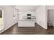Modern kitchen with white cabinets, granite countertops and island at 175 Amberjack Trail, Covington, GA 30016