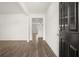 Inviting entryway with hardwood floors and neutral paint at 205 Amberjack Trail, Covington, GA 30016