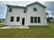 Back exterior of home with vinyl siding, dark shutters, and a lawn at 2180 Highridge Point Dr, Lithia Springs, GA 30122