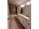 Bathroom with double vanity, granite countertop, tiled shower, and tub combo at 2180 Highridge Point Dr, Lithia Springs, GA 30122
