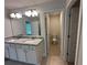 Bathroom featuring granite countertops, a dual vanity and an adjacent toilet room at 2180 Highridge Point Dr, Lithia Springs, GA 30122
