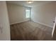 Cozy carpeted bedroom with one window at 2180 Highridge Point Dr, Lithia Springs, GA 30122