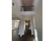 Bright, two-story foyer showcasing wood floors and staircase access to the second floor at 2180 Highridge Point Dr, Lithia Springs, GA 30122