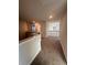 Hallway with carpet floor, neutral paint, and natural light from a window at 2180 Highridge Point Dr, Lithia Springs, GA 30122