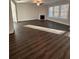 Spacious living room boasting a fireplace, wood floors and big, bright windows at 2180 Highridge Point Dr, Lithia Springs, GA 30122
