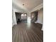 Open-concept living area featuring wood floors and lots of natural light at 2180 Highridge Point Dr, Lithia Springs, GA 30122