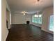 Spacious living room with fireplace and dark laminate flooring at 2180 Highridge Point Dr, Lithia Springs, GA 30122