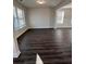 Bright living room showcasing wood floors, natural light and neutral walls at 2180 Highridge Point Dr, Lithia Springs, GA 30122