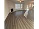 Spacious living room with fireplace, wood floors and plenty of natural light at 2180 Highridge Point Dr, Lithia Springs, GA 30122