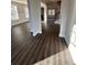 Open living area showcasing lots of natural light, wood floors and elegant columns at 2180 Highridge Point Dr, Lithia Springs, GA 30122
