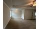 Spacious main bedroom with neutral walls and carpet and large windows at 2180 Highridge Point Dr, Lithia Springs, GA 30122