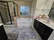 Bathroom with soaking tub, shower, and double vanity at 2368 Misty Ivy Ct, Buford, GA 30519