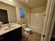 Clean bathroom with tub shower combo and single vanity at 2368 Misty Ivy Ct, Buford, GA 30519